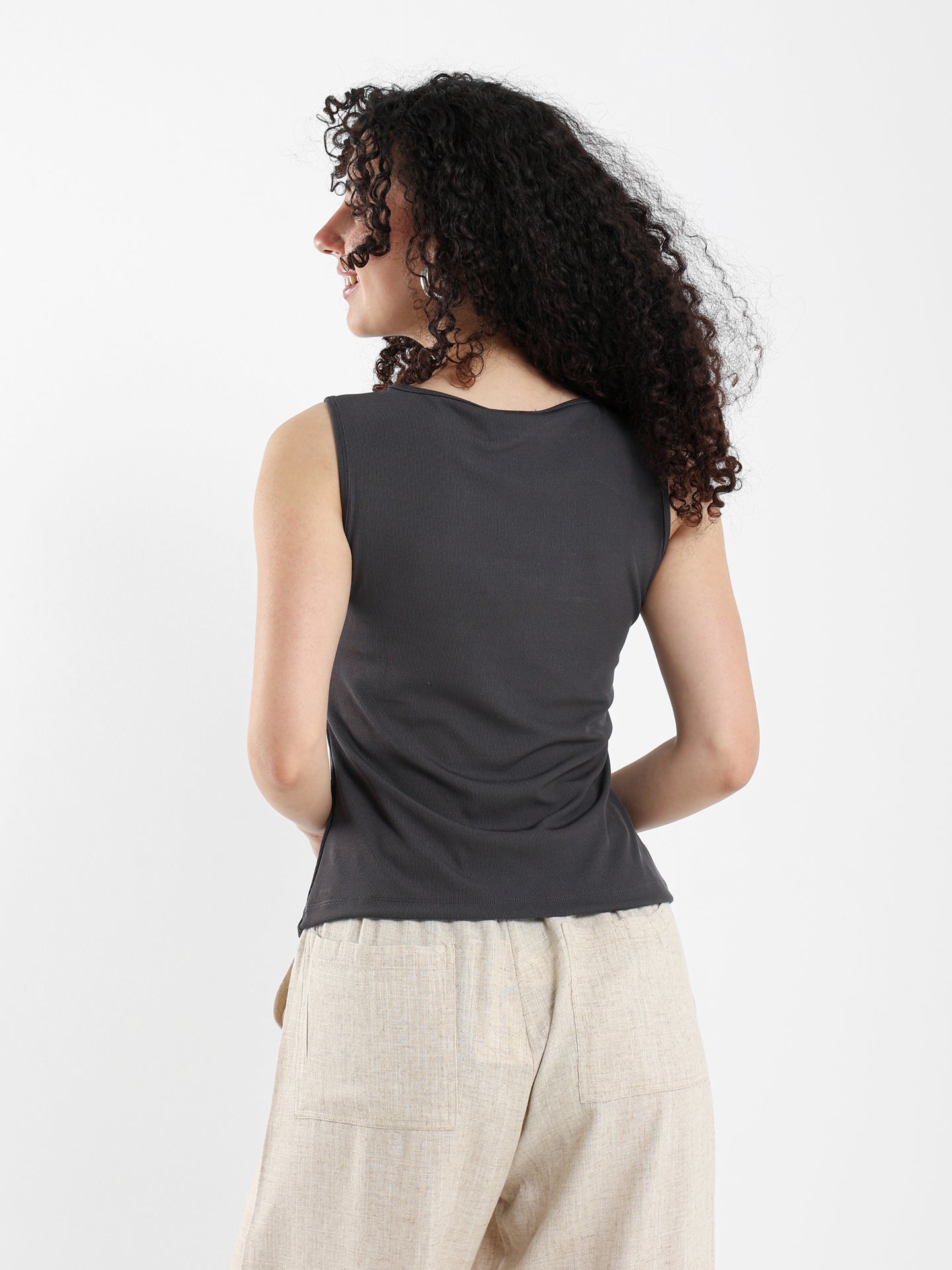 Asymmetric Sleeveless Top with Side Snap Hem
