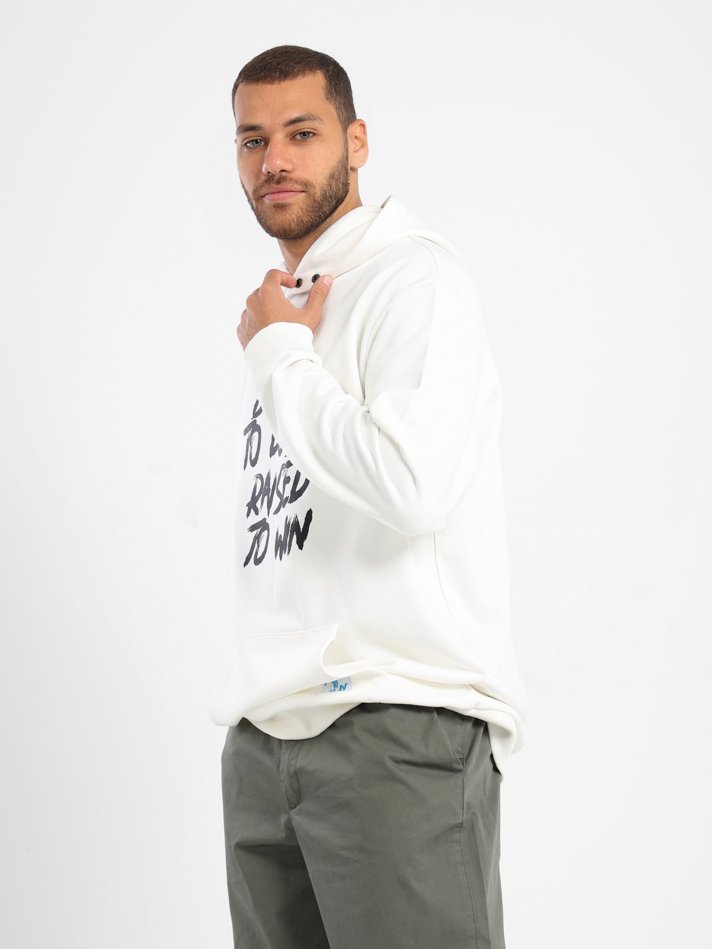 Raised To Win Print Hoodie With Woven Badge On Pocket - Outlet