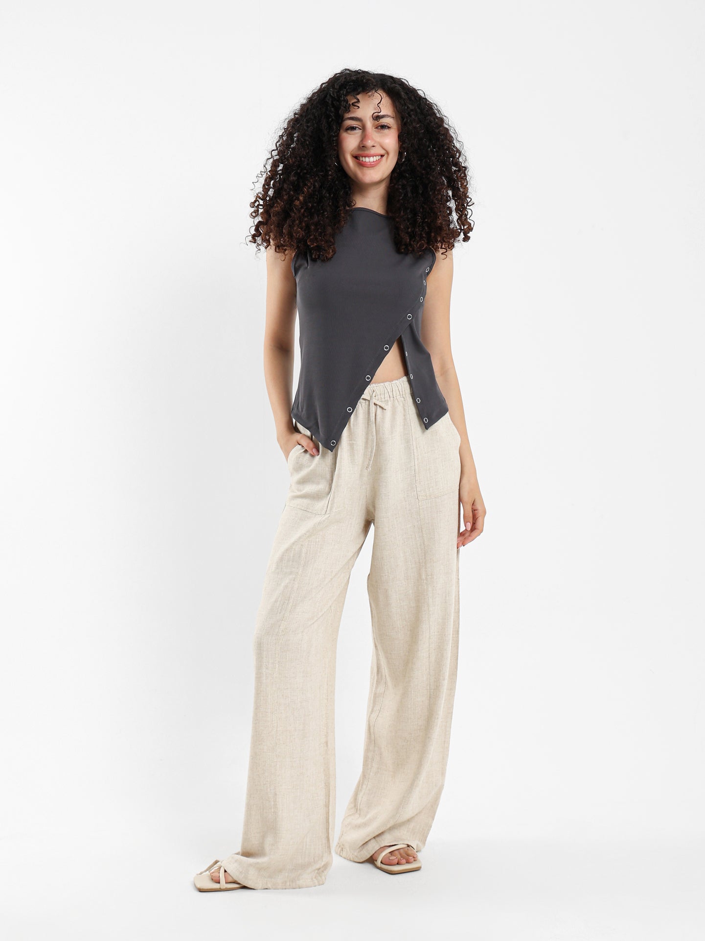 Asymmetric Sleeveless Top with Side Snap Hem