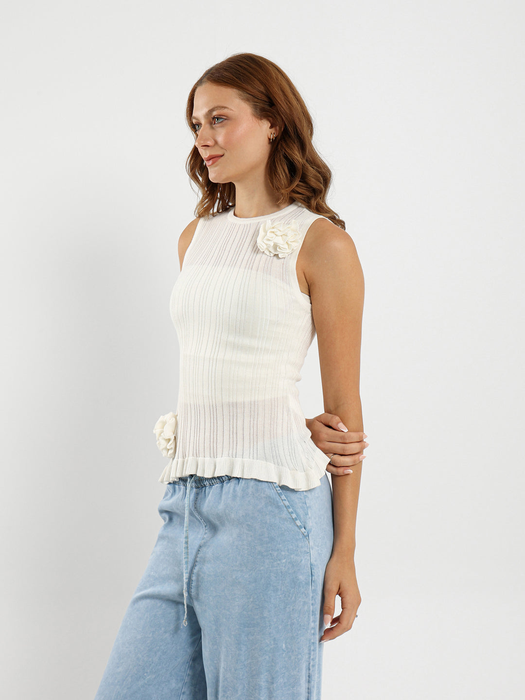 Sleeveless Top With Ruffle Hem And Flower Trim