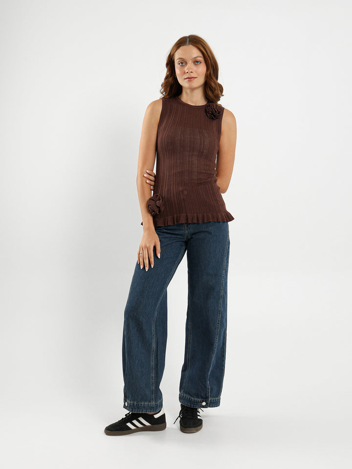 Sleeveless Top With Ruffle Hem And Flower Trim