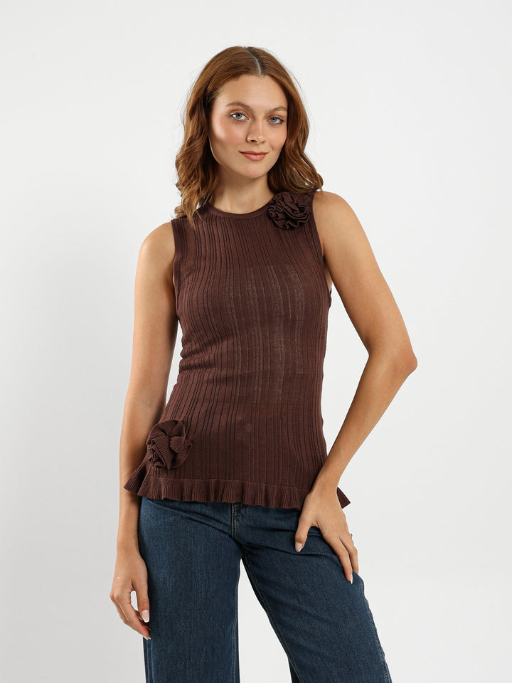 Sleeveless Top With Ruffle Hem And Flower Trim