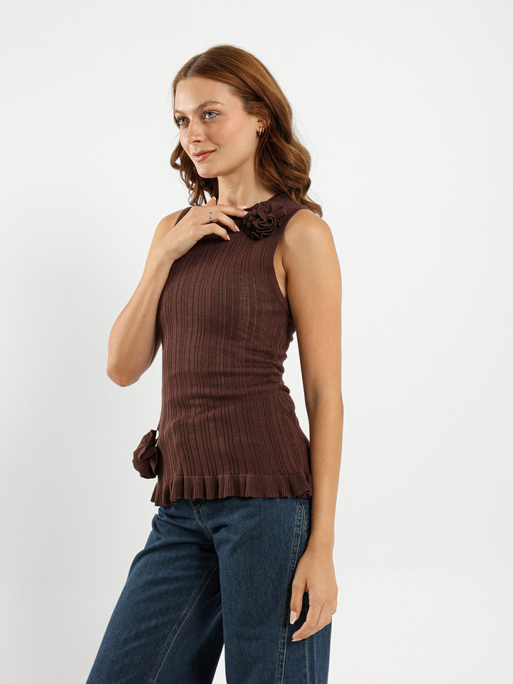Sleeveless Top With Ruffle Hem And Flower Trim